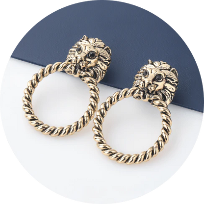 Close-up of the magnificent lion head stud earrings with a twisted hoop design, exuding power and confidence.