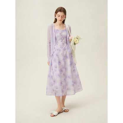 Elegant floral sleeveless summer dress in orange with a flattering A-line silhouette, perfect for British summer occasions.