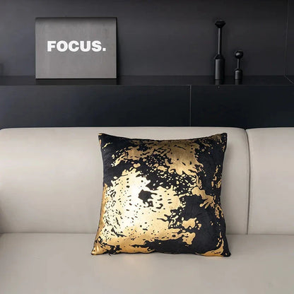 Pair of Nordic-inspired geometric plush pillowcases with a luxurious gold pattern on a white and black background