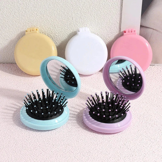 Portable folding hair comb with mirror, featuring a dual-sided design with a round mirror and eco-friendly hairbrush for on-the-go styling and grooming