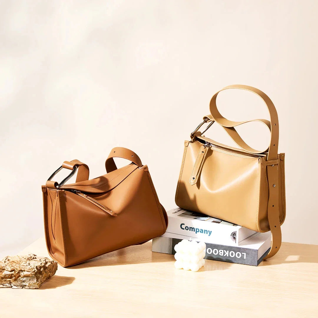 Genuine leather shoulder bag with soft, pillow-like shape and secure zipper closure