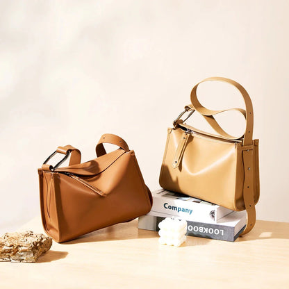 Genuine leather shoulder bag with soft, pillow-like shape and secure zipper closure
