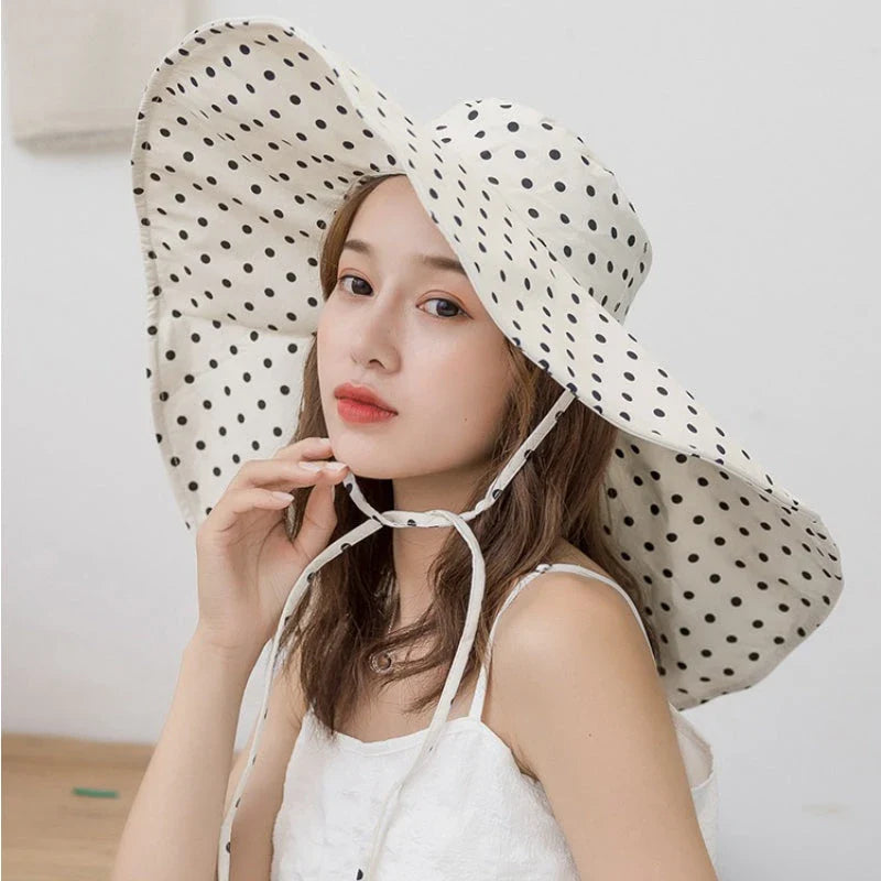 Elegant oversized polka dot sun hat for stylish UK women, offering excellent sun protection and a classic, fashionable design.