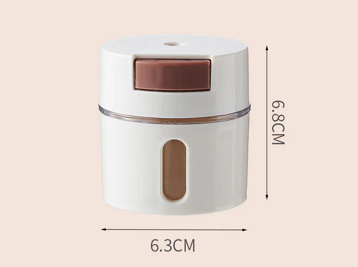 A modern, wall-mounted glass salt dispenser with magnetic suction and precise quantitative control for effortless kitchen organisation.