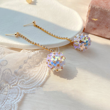 Elegant sterling silver floral drop earrings with delicate petal details, a timeless accessory for the modern British woman.
