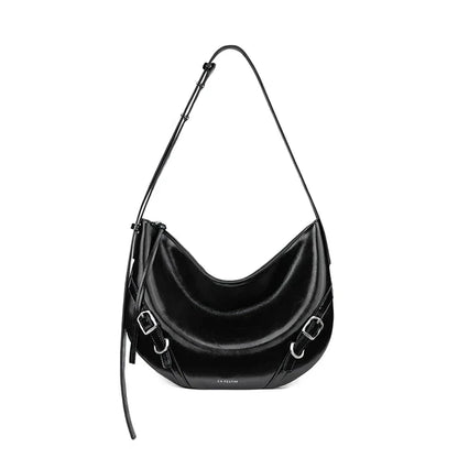 Elegant leather shoulder and crossbody bag for women, featuring a spacious main compartment, interior zip pocket, and contemporary design