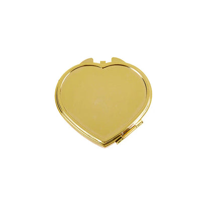 Heart-shaped metal pill box with built-in mirror for convenient storage and touch-ups on the go