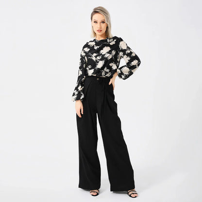 Elegant ladies' blouse with a printed pattern, dropped collar, and long sleeves in a classic white colour