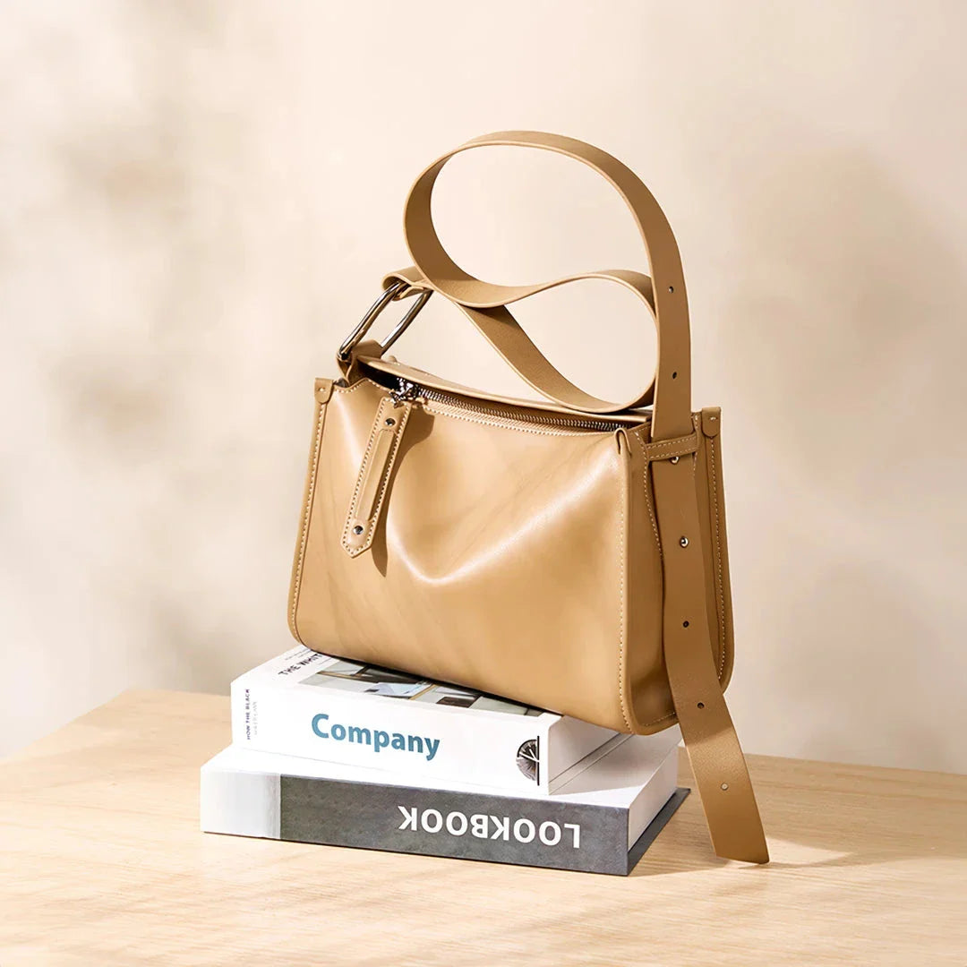 Genuine leather shoulder bag with soft, pillow-like shape and secure zipper closure