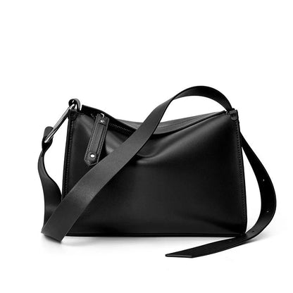 Genuine leather shoulder bag with soft, pillow-like shape and secure zipper closure