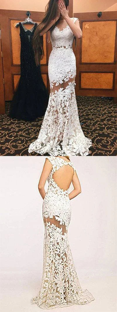 Elegant white lace cocktail dress with sleeveless design and flowing skirt