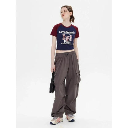 Enchanting animal print crop top with raglan sleeves and distressed details, perfect for casual summer outfits.