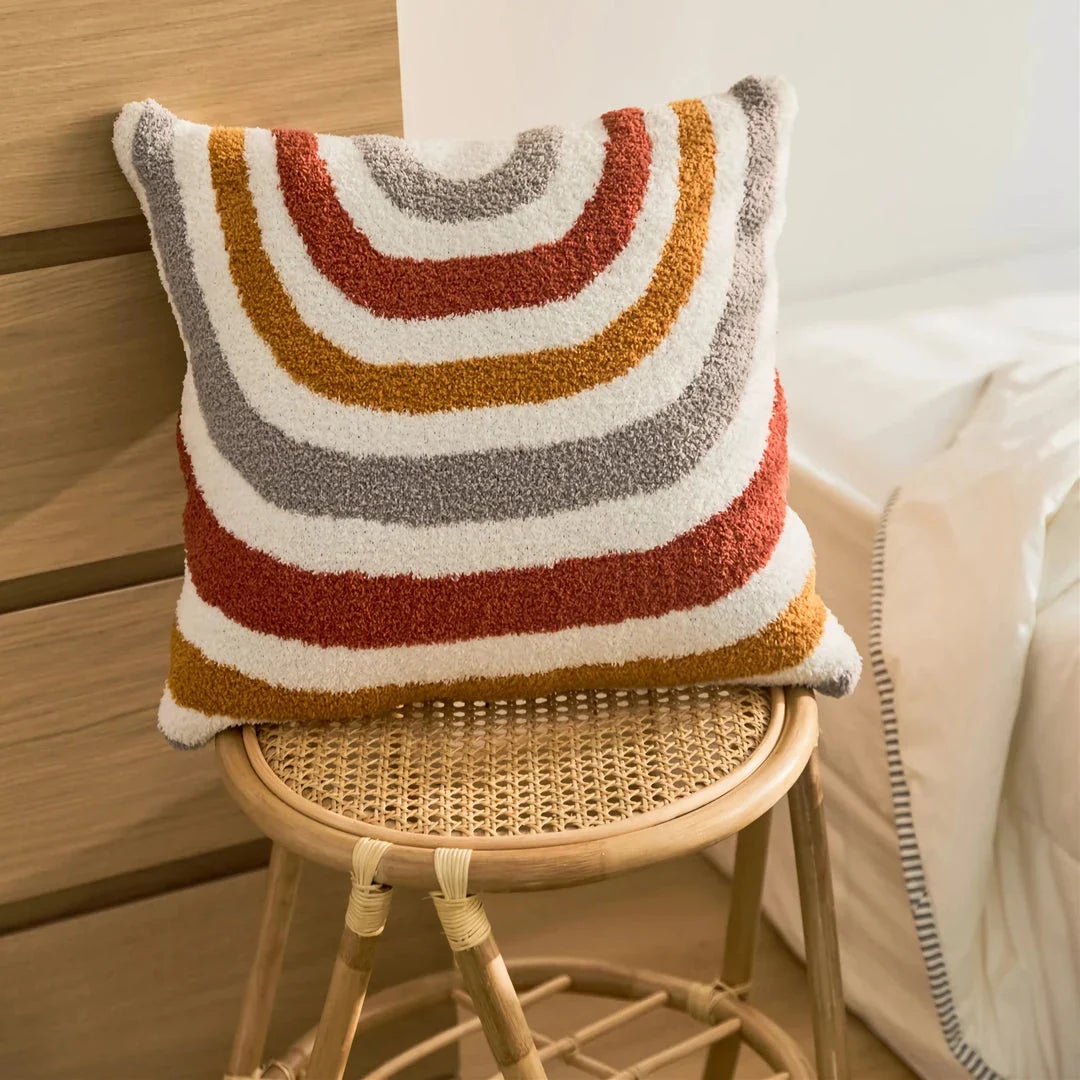 Bohemian-inspired microfibre cushion cover in light pink and white with a cosy, fuzzy texture