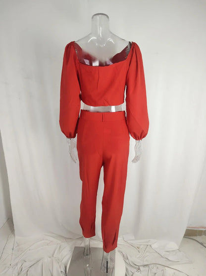 A stylish two-piece set with a square neckline top and ankle-tie trousers, made of premium polyester fabric and available in a range of vibrant solid colours.