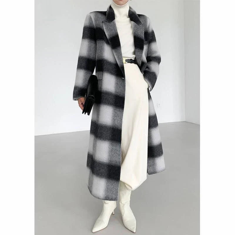 Elegant plaid double-breasted long woollen coat for women, featuring a premium blend of wool, cotton and polyester for exceptional quality and warmth.