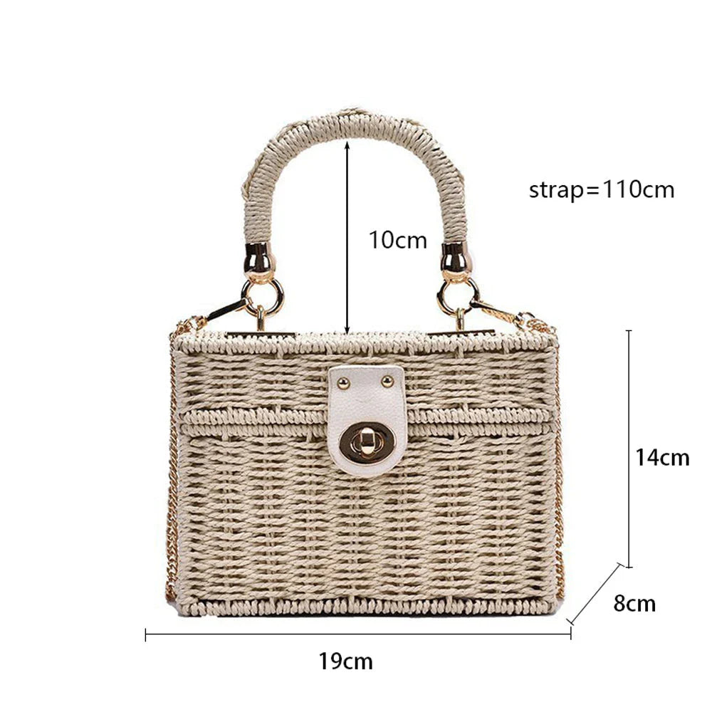 Handcrafted natural straw beach bag with bohemian-inspired design and detachable metal chain strap