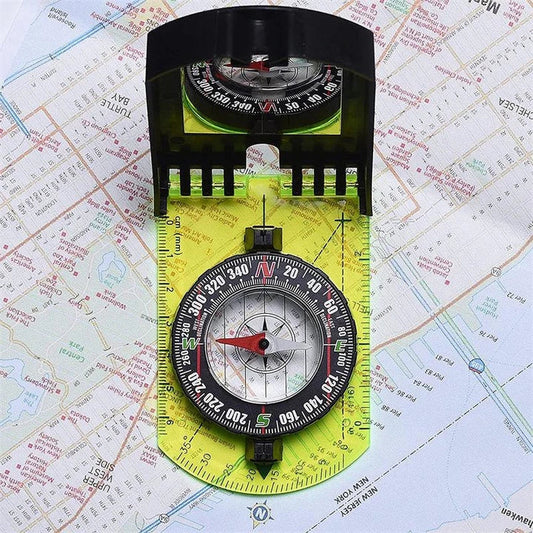 Multifunctional outdoor compass with scale, map ruler, mirror, and durable yellow casing for reliable navigation in the wilderness