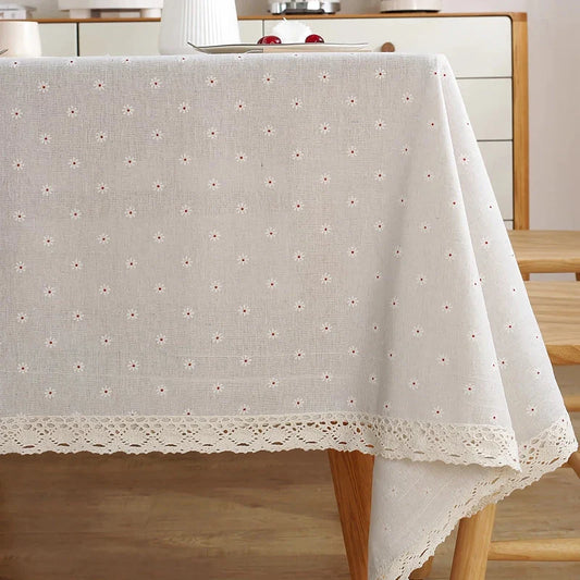 Elegant polyester linen tablecloth with delicate lace edging, available in various sizes for a sophisticated dining experience.
