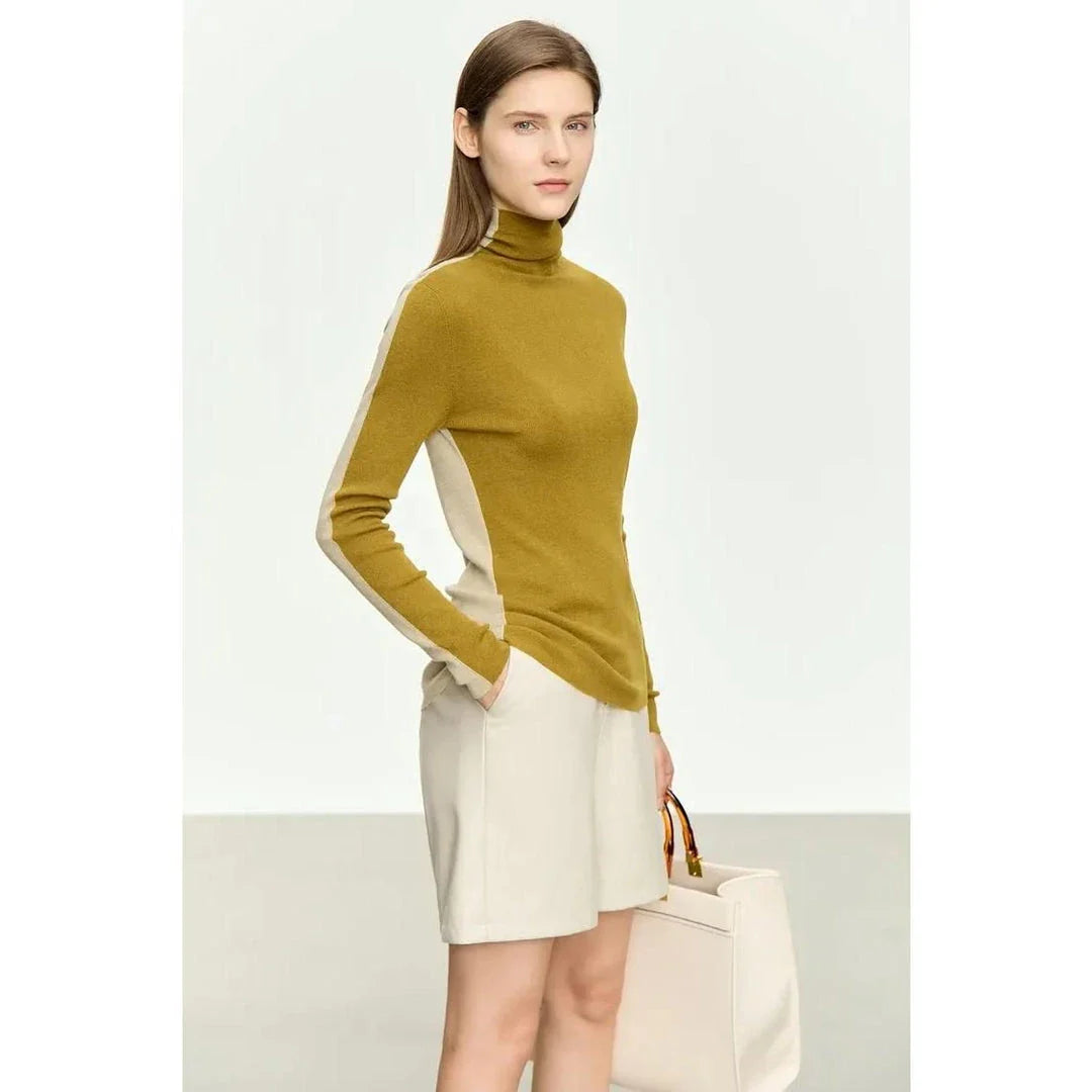 A cosy and stylish turtleneck sweater with a unique patchwork design, made from a premium wool blend for exceptional comfort and elegance.