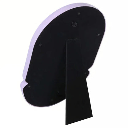 Elegant irregular oval-shaped tabletop mirror with sleek black plastic frame, perfect for adding sophisticated style to home décor