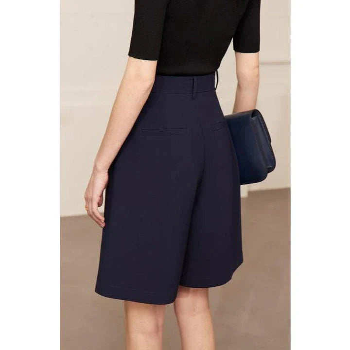 Elegant wide-leg shirred shorts in deep blue, designed for the modern British woman