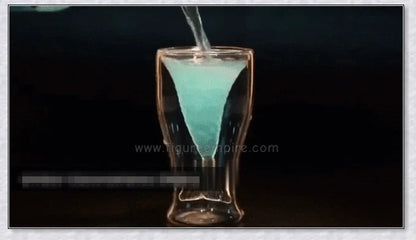 A transparent glass mug with a decorative mermaid tail design, perfect for enjoying a range of beverages in style.