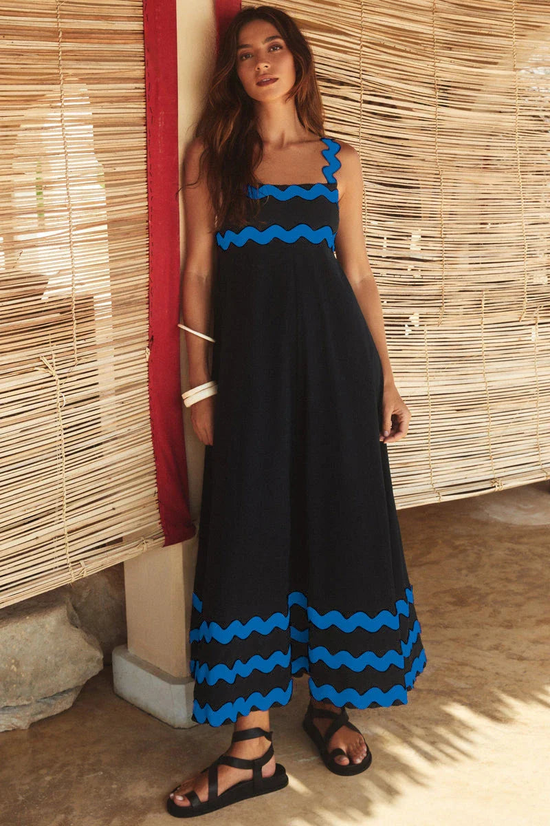 Elegant floral print suspender midi dress in black, perfect for summer beach holidays in the UK