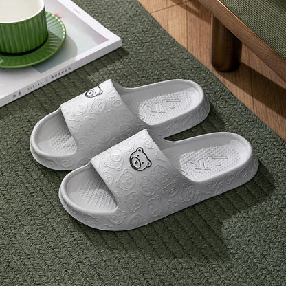 Cosy bear paw slippers in purple colour with soft, plush lining for relaxing indoor wear