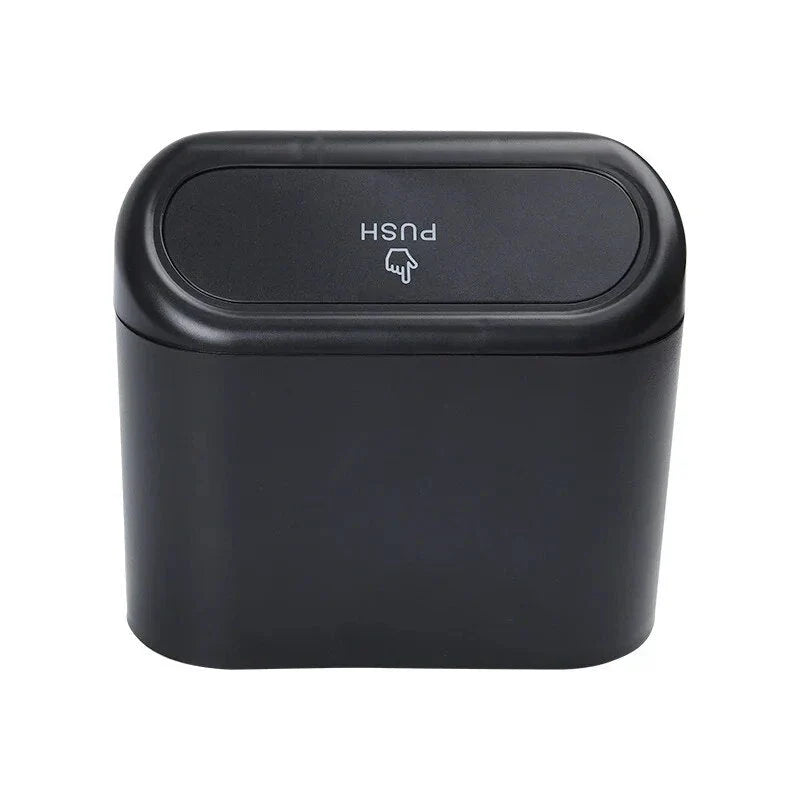 A compact black car bin with a press-type lid, designed to hang on the door panel and store garbage securely
