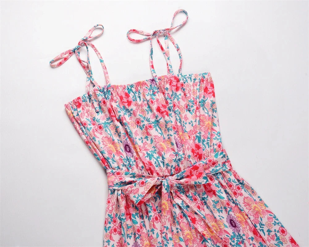 Printed camisole dress with a flattering mid-length swing skirt and a high-waisted design for a stylish, figure-enhancing look.
