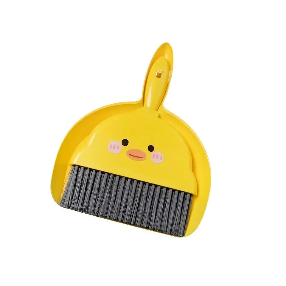 Compact table broom and dustpan set for children, featuring a yellow broom and dustpan made of durable materials for easy cleaning and tidying of small spaces.
