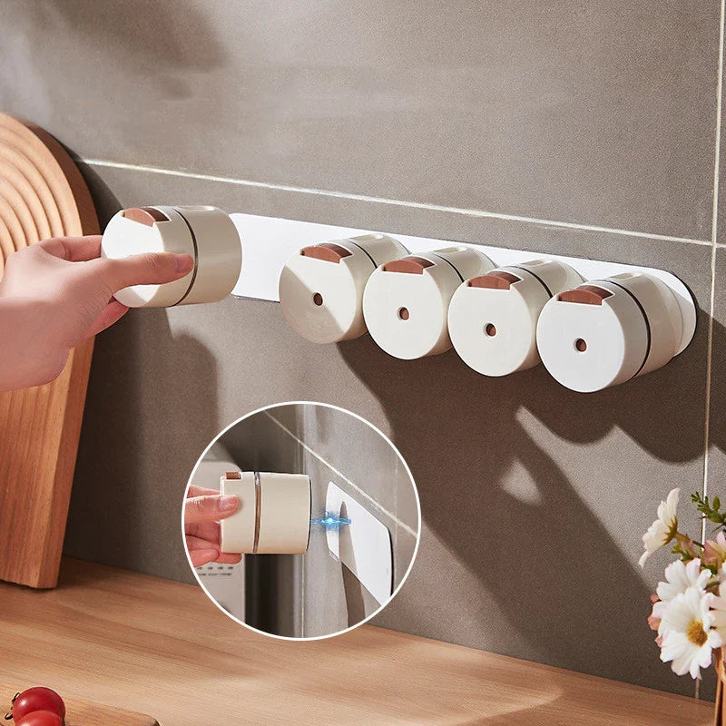 A modern, wall-mounted glass salt dispenser with magnetic suction and precise quantitative control for effortless kitchen organisation.