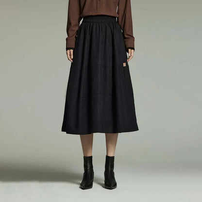 A stylish and sophisticated mid-length A-line pleated skirt with pockets, crafted from high-quality twill fabric for durability and comfort.