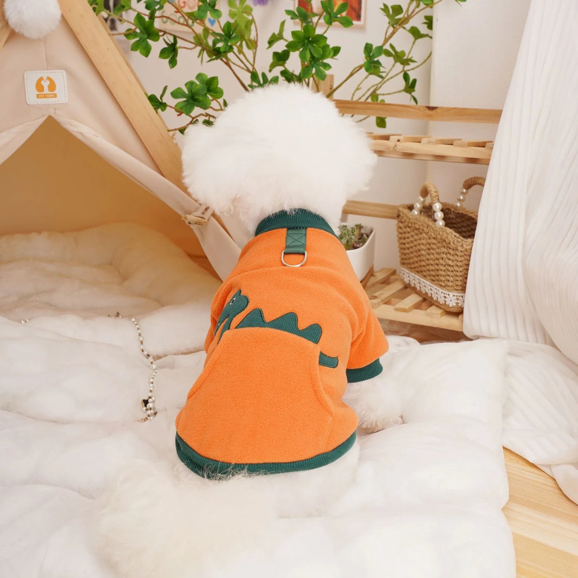 Plush and cosy pet clothing in various colours, designed for warmth and comfort
