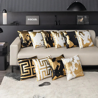 Pair of Nordic-inspired geometric plush pillowcases with a luxurious gold pattern on a white and black background