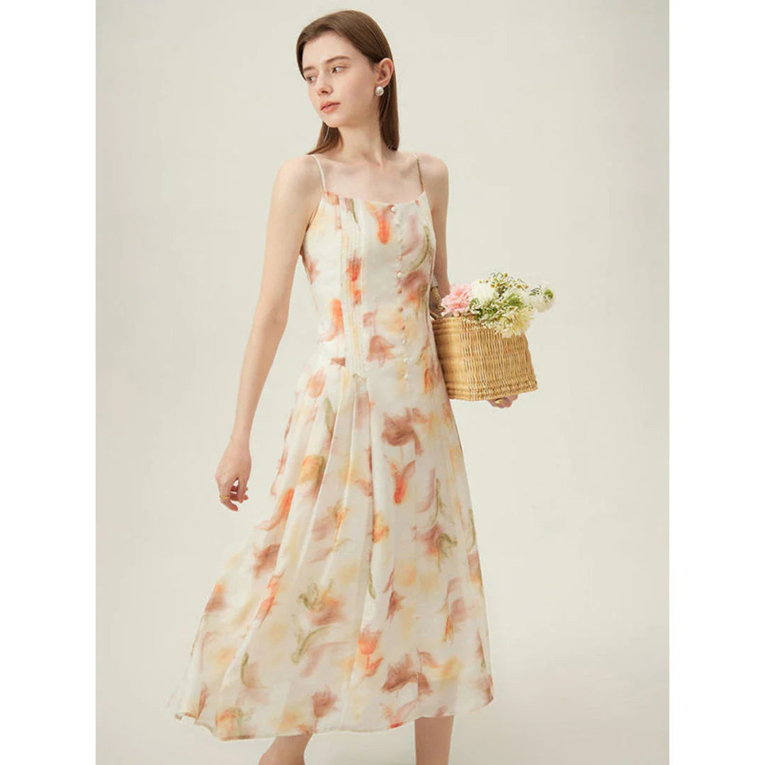Elegant floral sleeveless summer dress in orange with a flattering A-line silhouette, perfect for British summer occasions.