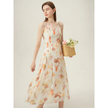 Elegant floral sleeveless summer dress in orange with a flattering A-line silhouette, perfect for British summer occasions.