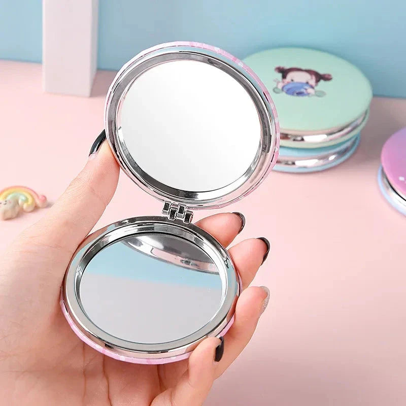 Compact portable foldable makeup mirror with cute cartoon prints for on-the-go beauty touch-ups