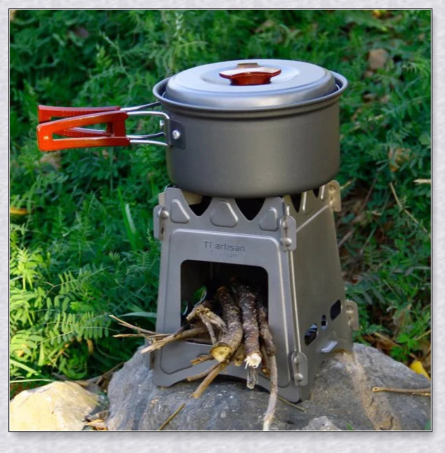 Compact titanium wood-fired camping stove with efficient air flow design and ultralight construction for easy portability
