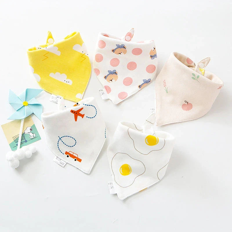 A set of fashionable cotton baby bandana bibs in various prints and colours, designed to keep your little one dry and stylish.