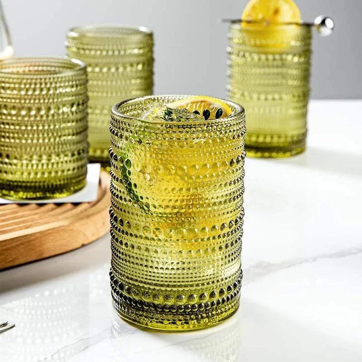 Set of 4 elegant retro-inspired drinking glasses with unique bead design and comfortable grip