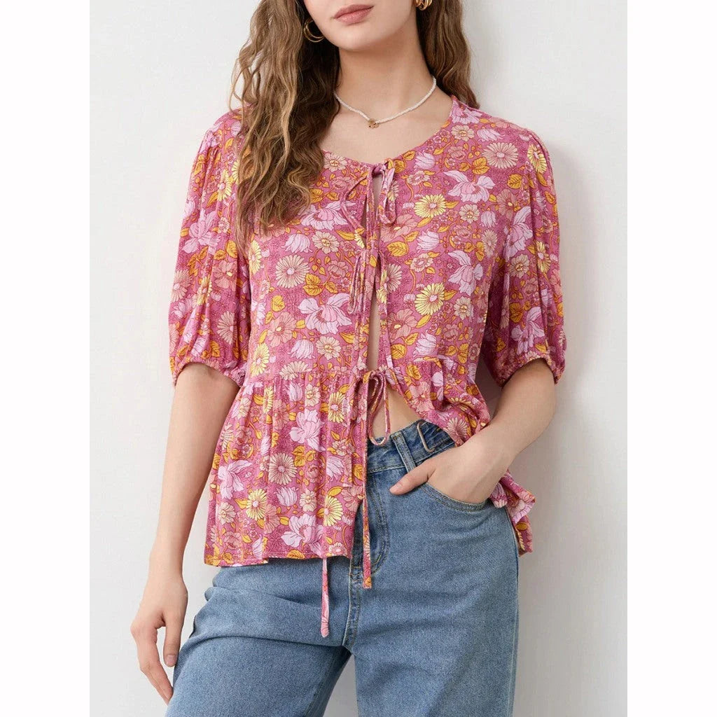 Elegant floral lace-up bow blouse with unique hollow-out details and a delicate floral print