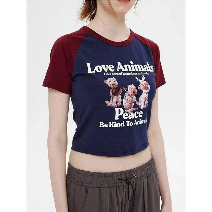 Enchanting animal print crop top with raglan sleeves and distressed details, perfect for casual summer outfits.