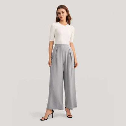 Chic silk wide-leg trousers in a sophisticated grey colour, featuring a high-waist design and relaxed fit for all-day comfort and style.