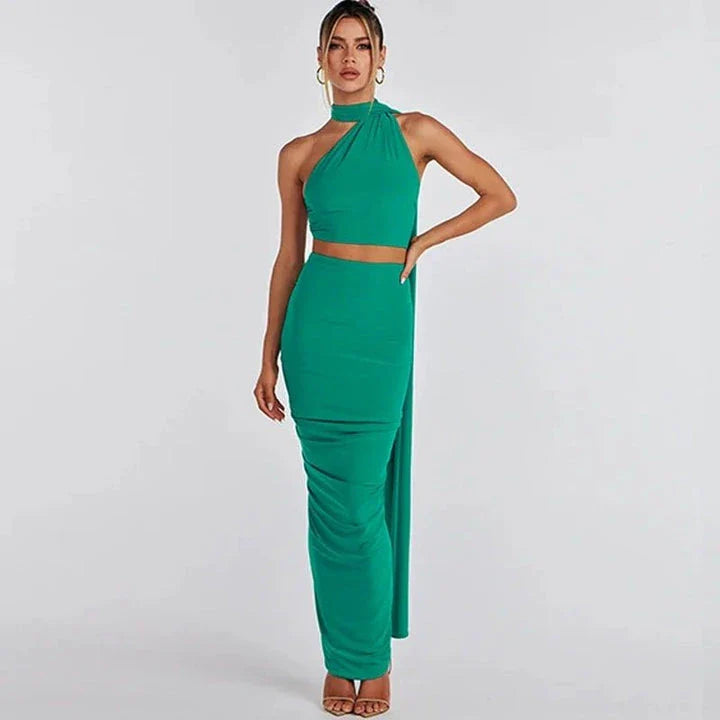 Elegant backless cocktail dress set with halter crop top and maxi skirt, perfect for summer events and occasions