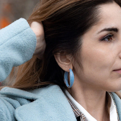 Pair of stunning blue gemstone drop earrings with a regal crown design, inlaid with shimmering zircon stones