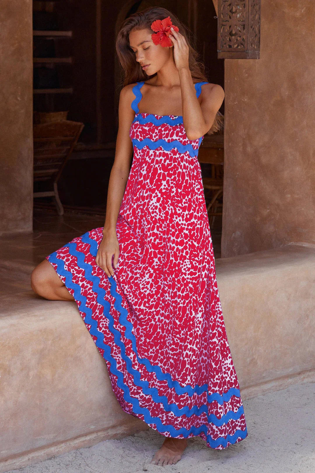 Elegant floral print suspender midi dress in black, perfect for summer beach holidays in the UK