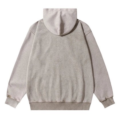 A premium cotton pullover hoodie with an embroidered letter patch in a variety of classic autumn colours