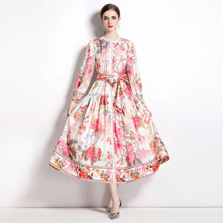 Elegant floral single-breasted swing dress with delicate print, tailored design, and flowing silhouette