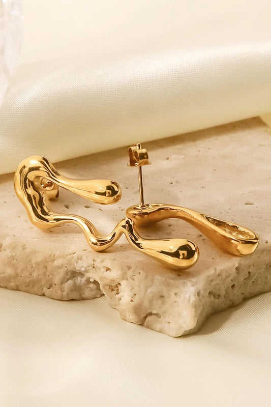 Pair of 18K gold-plated geometric mismatched earrings with varying lengths and shapes